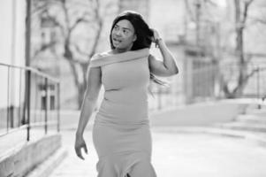 African american woman model xxl in orange dress. photo