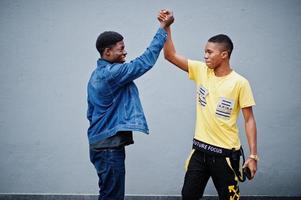 Two african male friends shaking hands. photo