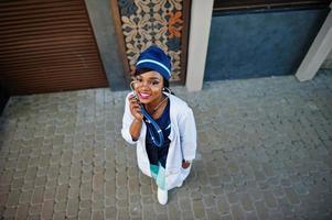 African american doctor female with stethoscope posed outdoor. photo