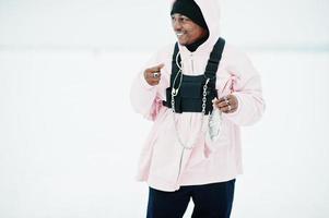 African american fisherman with fresh frozen fish at hand. Winter fishing. photo