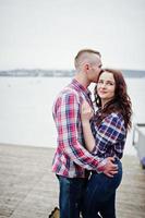 Stylish couple wear on checkered shirt in love together. photo