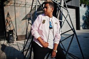 Stylish hipster arab man guy posed outdoor in street. Style rap singer. photo