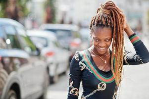 Portrait of handsome stylish african american model woman posed at street. photo