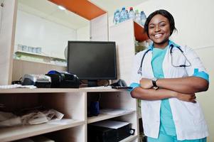 African american pharmacist working in drugstore at hospital pharmacy. African healthcare. photo