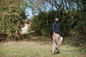 South asian agronomist farmer inspecting his farm. Agriculture production concept. photo