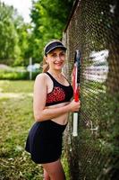 Beautiful sport woman tennis player with racket in sportswear costume. photo