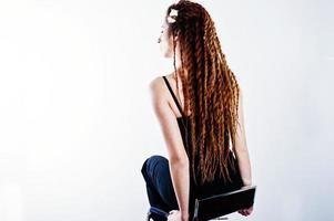 Studio shoot of back girl with dreads on white background. photo