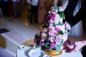 Big amazing wedding cake with flowers. photo