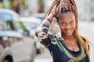 Portrait of handsome stylish african american model woman posed at street. photo