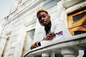 Chic handsome african american man in white suit. photo