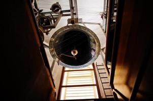 Close-up view of metal orthodox church bells in tower. photo