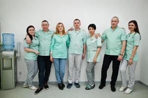 Medical theme. Portrait of the group of doctors at reception of diagnostic center in hospital. photo