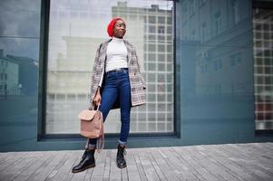 Young modern fashionable, attractive, tall and slim african muslim woman in hijab or turban head scarf posed. photo