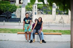 Three african american friends posed outdoor together. photo