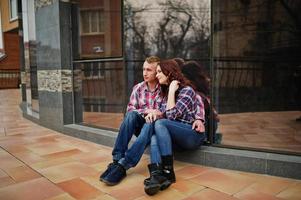 Stylish couple wear on checkered shirt in love together. photo