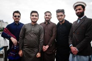 Group of pakistani man wearing traditional clothes salwar kameez or kurta. photo