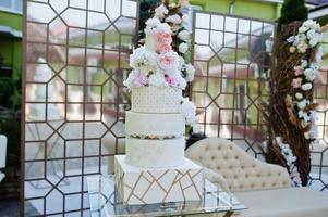 Big amazing wedding cake with flowers. photo