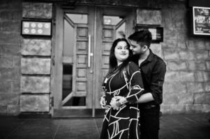 Love story of indian couple posed outdoor. photo