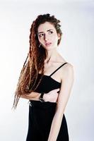 Studio shoot of girl in black with dreads on white background. photo