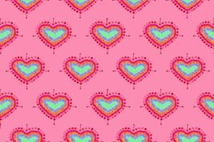 pattern of freehand sketch shape heart, colorful red green blue yeloow orange color design elements isolated on pink background, symbol love Valentine Day, textile Fabric photo