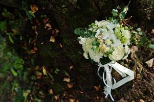 Beautiful tender wedding bouquet and rings. photo