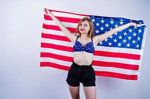 Cute girl in bra and shorts with american usa flag isolated on white background.