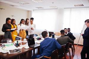 Diverse business people on a meeting at round table. photo