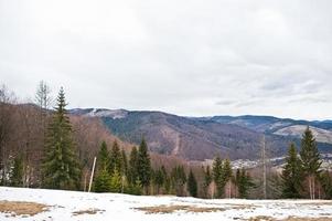 Snowy mountain valleys at Carpathian mountains. View of Ukrainian Carpathians and Yaremche from the top of Makovitsa. photo