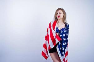 Cute girl in bra and shorts with american usa flag isolated on white background. photo