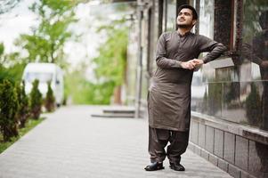 Indo pakistani man wear traditional clothes achkan or sherwani. photo