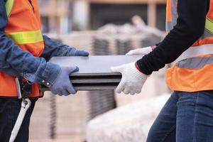 Lightweight brick mason is made of expanded clay. Elements in masonry construction The builder holds the bricks A man wearing a hard hat on a construction site photo