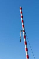 a railway barrier with a view from below photo