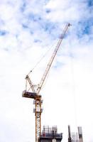 Tower crane working in construction site photo