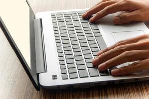 A man working with laptop photo