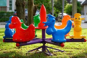 Colorful carousels in the playground photo