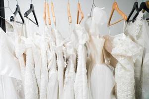 Wedding dresses hanging on a hanger. Fashion look.Beautiful bridal dress on hangers photo