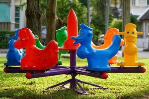 Colorful carousels in the playground photo
