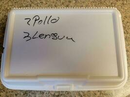 mexican food take out box saying 2 pollo chicken and 3 lengua tongue photo