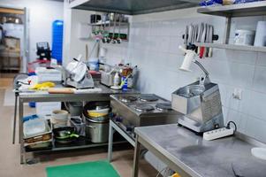 Interior of kitchen in restaurant and desk. photo