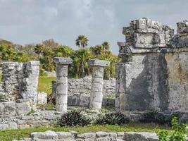 Ancient Tulum ruins Mayan site temple pyramids artifacts seascape Mexico. photo