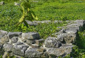 Ancient Tulum ruins Mayan site temple pyramids artifacts seascape Mexico. photo