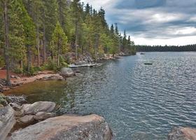 Lakeshore View with Boats and Dramatic Sky photo