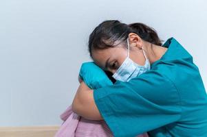 Asian doctor with Syringe and vaccine for protect covid-19 virus on white background photo