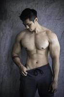 Portrait of asian man big muscle at the gym,Thailand people,Workout for good healthy,Body weight training,Fitness at the gym concept photo