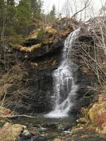 waterfall in the mountains photo