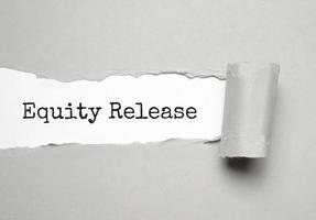 Equity Release text on white torn paper photo