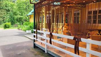 An empty summer cafe in the park on a sunny day photo