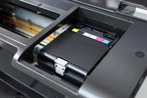 Close up of a multicolor ink cartridges container of a printer photo