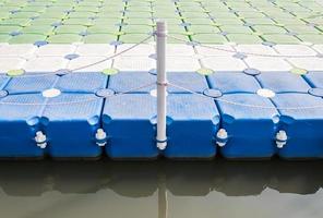 Plastic pontoon with the rope fence. photo