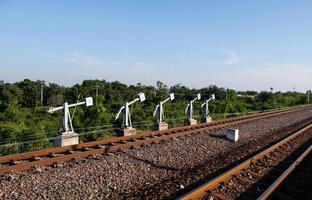 Lever wire compensator row of the railroad switch system. photo